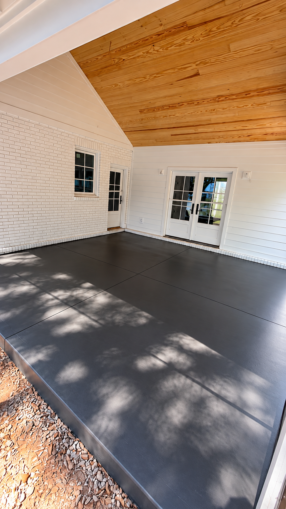 Modern covered patio with finished concrete and wood structure